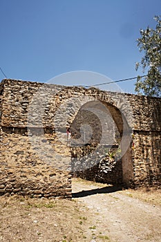 Casa Hacienda de Yaca from the abandoned and dilapidated sugar industry arc and door dirth road 20th century adobe