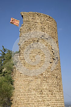 Historic castle flying Spanish flag near village of Solsona, Cataluna, Spain photo