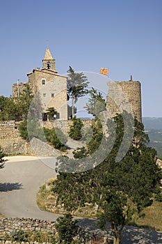 Historic castle flying Spanish flag near village of Solsona, Cataluna, Spain photo