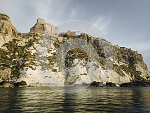 Historic castle ruins on a cliff over water at the Tremiti Islands in Puglia, Italy