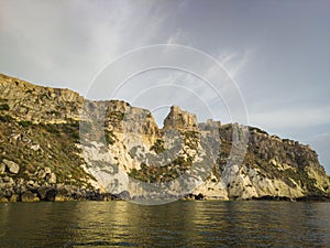 Historic castle ruins on a cliff over water at the Tremiti Islands in Puglia, Italy