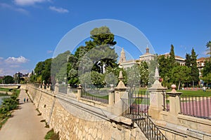 Historic center of Murcia city with stone architecture and lush greenery under blue sky in Spain