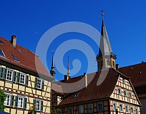 Historic Center of Weikersheim with church steeples and fachwerk buildings.