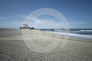 The historic chapel of Senhor da Pedra at Miramar beach, Portugal