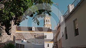 Historic Church Tower Overlooking a Quiet Town Street