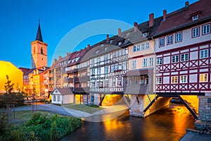 Historic city center of Erfurt with famous KrÃÂ¤merbrÃÂ¼cke bridge illuminated at twilight, ThÃÂ¼ringen, Germany