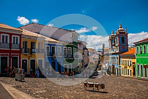 Historic city center of Pelourinho features brightly lit skyline of colonial architecture on a broad cobblestone hill in Salvador