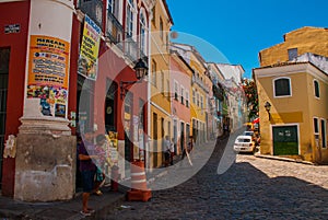 Historic city center of Pelourinho features brightly lit skyline of colonial architecture on a broad cobblestone hill in Salvador