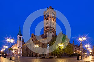 Historic city center in Torun. Statue of astronomer Nicolaus Copernicus and the Town Hall. Torun, Poland