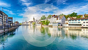 Historic city center of Zurich with famous Fraumunster Church and swans on river Limmat on a sunny day, Switzerland photo