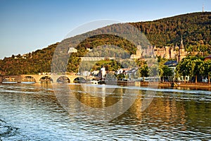 The historic city of Heidelberg with the castle, the Old Bridge, river Neckar and the Bridge Gate. Germany