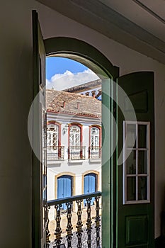 Historic city of Ouro Preto houses seen through the doors