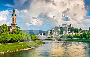 Historic city of Salzburg with dramatic clouds in summer, Austria photo