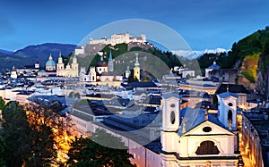 Historic city of Salzburg with Hohensalzburg Fortress at dusk, S