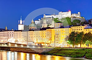 Historic city of Salzburg with Hohensalzburg Fortress at dusk, S