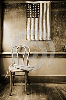 Historic classroom with 38 star flag and paddles f