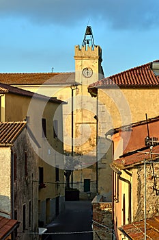 Historic clock tower with bells in the city of Magliano in Toscana