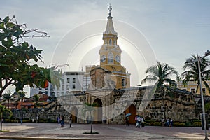 The historic clock tower gate with the setting sun behind, the main entrance into the old walled city of Cartagena, Colombia.