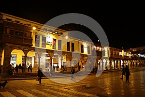 Historic Colonial Buildings on the Plaza de Armas Square with Many Visitor at Night, Cusco, Peru, South America, 10th May 2018