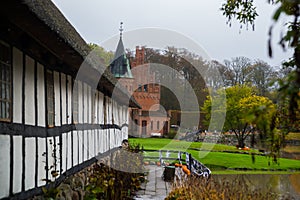 Historic Danish house on the Egeskov castle grounds. Landscape with beautiful autumn. Egeskov Slot, Denmark, Europe