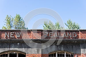 Historic derelict New Zealand Shipping brick building at Tokomaru Bay photo