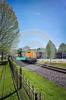 Historic downtown Madison with a classic train against a bright blue sky in United States