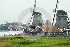 Historic Dutch village with old windmills and river landscape