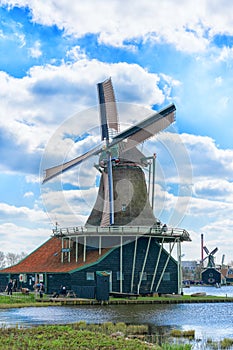 Historic Dutch Windmill in Zaanse Schans on the Zaan River in the Netherlands