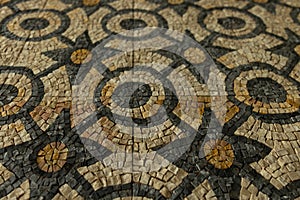 historic earth muted tones geometrically patterned mosaic floor background