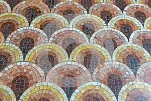 historic earth muted tones geometrically patterned petal like mosaic floor background