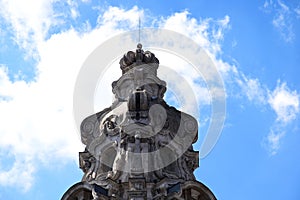 Historic eclectic style tower detail in Budapest. blue sky and white clouds.