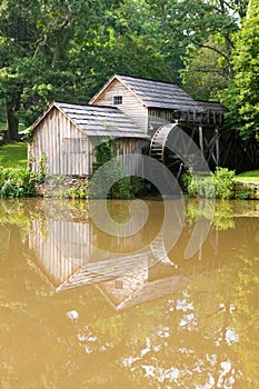 Historic Edwin B. Mabry Grist Mill (Mabry Mill) in rural Virginia on Blue Ridge Parkway and reflection on pond in summer