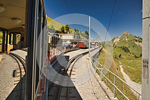 Historic electric train of the Schynige Platte Bahn SPB rack railway close to the summit station in the Bernese Alps.