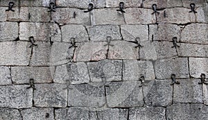 Historic fieldstone wall reinforced with wrought iron parts