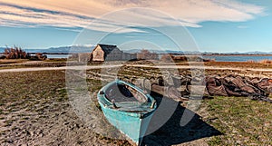 Historic fishing village and the Etang de Canet lagoon and Canigou in the background