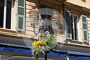 Historic form street lamp in the city of Nice