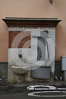 Historic fountain with manual pump of 1893 photo