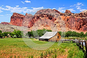 Historic Fruita Barn and red mountains of Capitol Reef National Park, Utah, USA