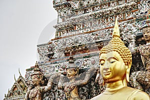 Historic golden Buddha statue in Wat Arun, Bangkok, Thailand