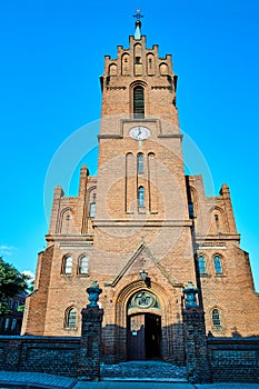 Historic, Gothic red brick church with belfry  in the city of Skwierzyna