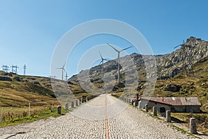 Historic Gotthard Pass road with cobblestones, wind turbines, Canton of Ticino, Switzerland