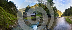 A historic grist mill building on the banks of Creek in Carpathian mountains, Slovakia, Europe. Old mill powered by water