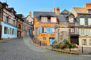 Historic half timbered buildings in Honfleur, France photo
