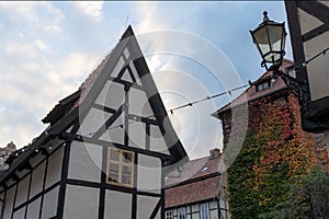 Historic half-timbered house and gable with autumn leaves in Quedlinburg