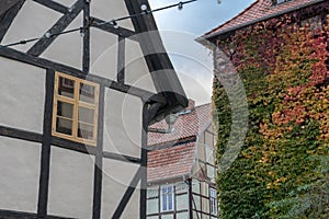 Historic half-timbered house and gable with autumn leaves in Quedlinburg, Germany