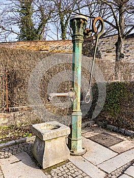 Historic hand water pump in Vysehrad area in Prague, Czech republic