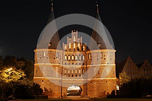 The historic Holstentor of Luebeck by night photo