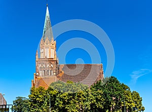 Historic Holy Mary gothic Kosciol Mariacki church in old town quarter of Trzebiatow in Poland