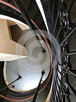 Historic hotel architecture scrollwork on staircase looking down