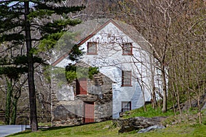 A historic house at the center of a newer addition in Harpers Ferry West Virginia.